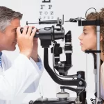 woman doing eye test with optometrist in medical clinic