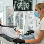 dentist and patient choose treatment during consultation with medical equipment in dentistry
