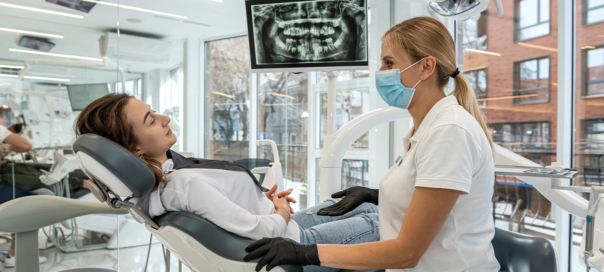 dentist and patient choose treatment during consultation with medical equipment in dentistry