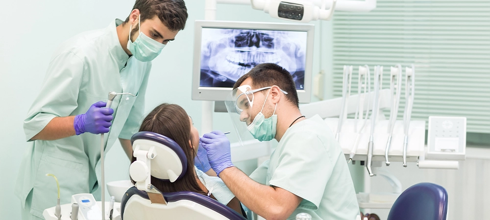 doctor dentist with an assistant work in a dental clinic