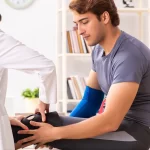 young male patient visiting female doctor traumatologist