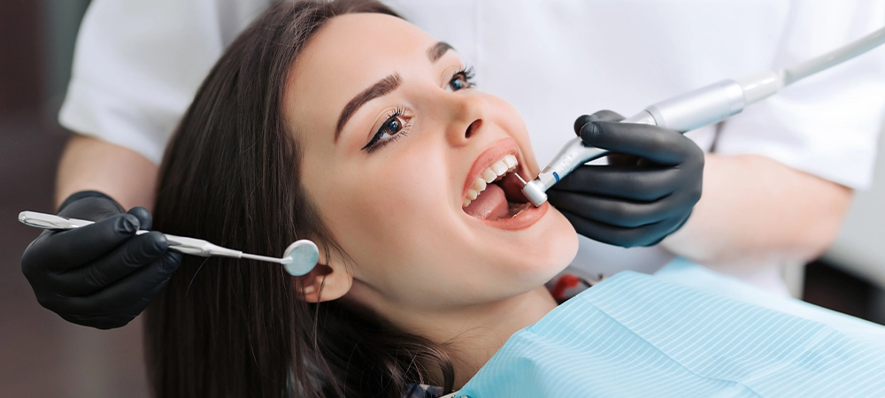 Close-up medical dentist procedure of teeth cleaning