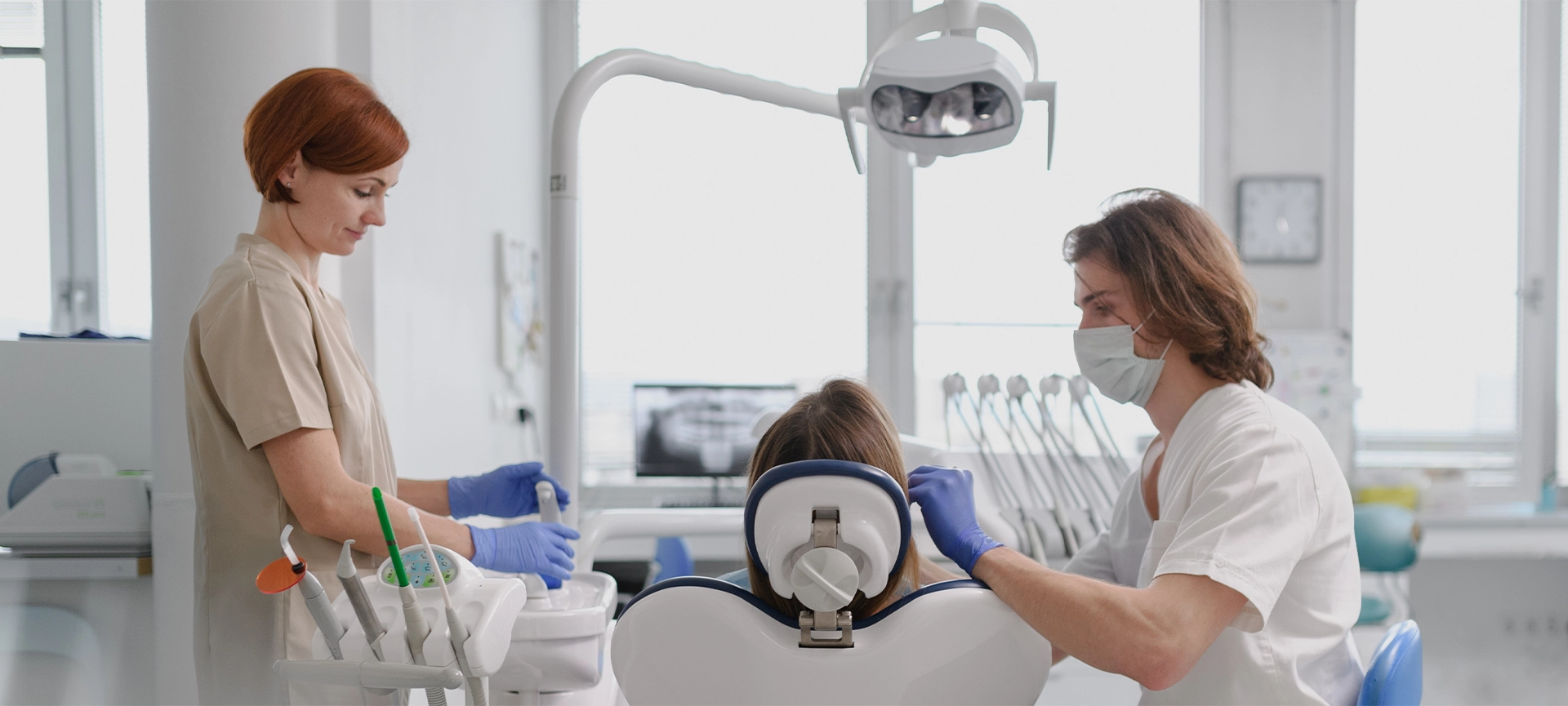 A woman has a check-up in dental clinic. Banner with copy space.