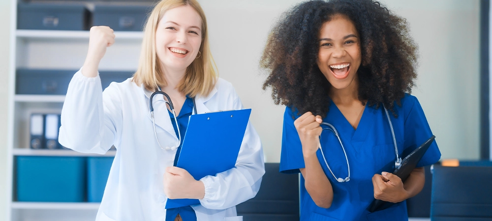 Young African American and Russian woman, both scientists, collaborate to analyze blood samples, viruses, vaccines using microscopes. They conduct crucial medical and biological research.