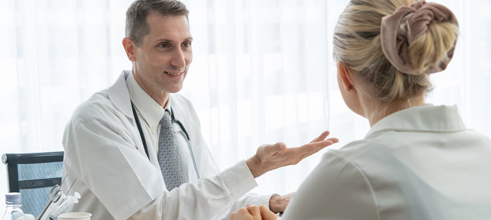 Doctor in professional uniform examining patient at hospital or medical clinic. Health care , medical and doctor staff service concept.