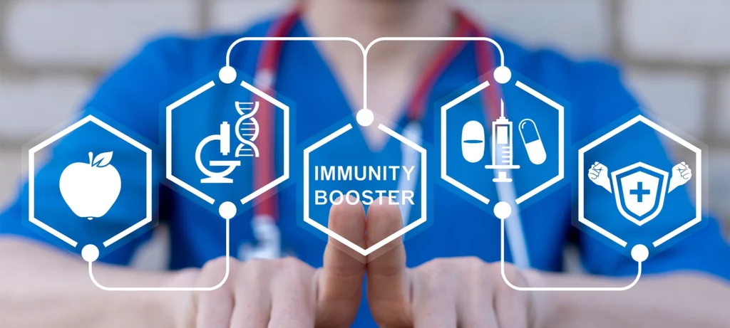 Doctor working on virtual touch screen presses inscription: IMMUNITY BOOSTER. Immunity booster medicine concept. Build Immune System.