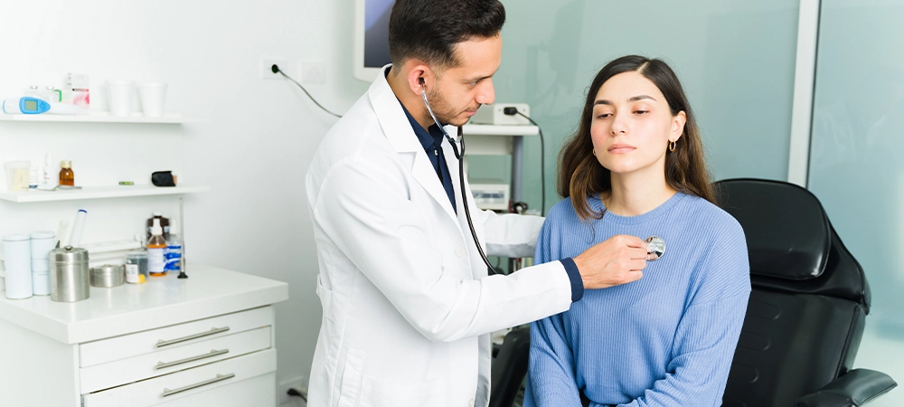 Sick young woman with respiratory problems